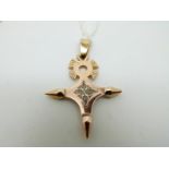 A yellow metal cross pendant with unusual filigree detail to the centre, 5.