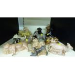 A large collection of Heredities ceramic animal figures including dogs, cats,