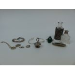 A silver Mexico brooch, Victorian silver button, two silver bangles, silver sleeve for a bottle,