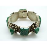 A Mexican sterling silver bracelet c1965 set with green onyx Mayan masks