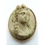 A 9ct gold brooch set with a lava cameo of a young women