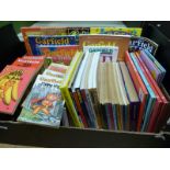 A collection of Garfield books to include cartoon softbacks, annuals,