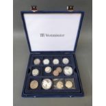 A collection of USA half dollars and two 'Walking Liberty' silver dollars in Westminster case,