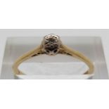 An 18ct gold ring set with a diamond, size O, 1.