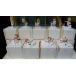 Fourteen 'Almost Angels' figures by Franklin Mint with display case