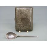 A hallmarked silver cigarette case with engraved decoration and a hallmarked silver spoon,