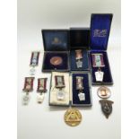 A collection of hallmarked silver and other Masonic jewels / medals, some cased, includes ivory,