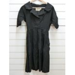 A 1950's black twill dress by fredrica, Starke of London,