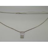 An 18ct white gold chain and a pendant set with diamonds in a rectangular setting