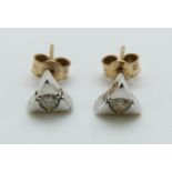 A pair of white gold earrings set with a diamond to each