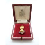 A 9ct gold Royal Artillery sweetheart brooch with 'Ubique' motto,