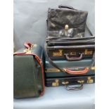 A collection of briefcases and messenger bags,