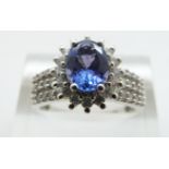 A 14ct white gold ring set with a tanzanite and diamonds, size O, 4.