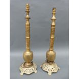 A pair of ornate brass table lamps,