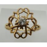 A 9ct gold ring set with a cubic zirconia (1.