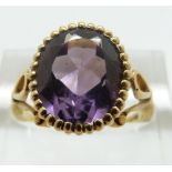 A 9ct gold ring set with an amethyst, size M, 4.