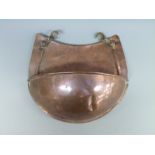 A 19thC Arts & Crafts copper drip tray or wall pocket with swing fastenings,