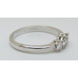 An 18ct white gold ring set with three diamonds totalling approximately 0.