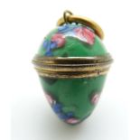 A 19thC egg pendant set with glass with screw top,