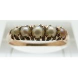 A yellow metal ring set with pearls, size P, 2.