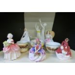 Royal Doulton figurines Sleeping Beauty, Annabel and Freedom, three Royal Doulton Seriesware cups,