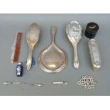 A hallmarked silver mounted four piece dressing table set comprising hand mirror,