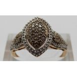 A 9ct gold ring set with diamonds in a cluster, size P, 3.