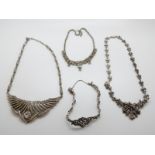 A silver necklace set with marcasite, a white metal necklace set with paste,