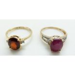 A 9ct gold ring set with a garnet and diamonds and a 9ct gold ring set with a ruby and diamonds,