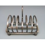 A George V hallmarked silver six slice toast rack Sheffield 1910 maker Cooper Brothers & Sons Ltd,