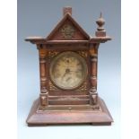 Pain Brothers, Hastings musical mantel clock in oak case, with carved and finialled decoration,