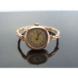 A 9ct gold ladies wristwatch with two-tone gold and silver face,