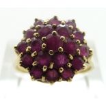 A 9ct gold ring set with rubies in a cluster, size P/Q, 4.