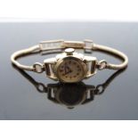 Certina 14ct gold ladies wristwatch with gold hands and baton and dot markers, silver face,