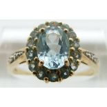 A 9ct gold ring set with aquamarines and diamonds, size P,