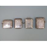 Four early 20thC hallmarked silver vesta cases with engraved foliate decoration