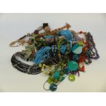 A collection of beaded necklaces to include agate, garnets,