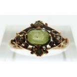 A 9ct gold ring set with a peridot and diamonds, size M, 2.