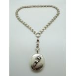 A Victorian silver locket with buckle decoration & original pierced accompanying chain necklace