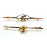 A 9ct gold brooch set with a pearl in a shell design and a 9ct gold brooch set with a sapphire and