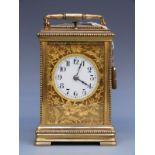 A French c1900 brass cased repeater carriage clock with beaded decoration to case and floral and