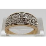 A 9ct gold ring set with diamonds in three rows, size O, 2.