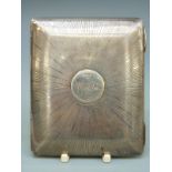 A George V Garrard hallmarked silver cigarette case with sunburst design, London 1913, length 8.