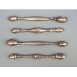 Four 19th/20thC hallmarked sterling silver and white metal glove darners,