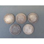 Five various shillings including George III, William III,
