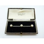 A 9ct gold brooch set with faux pearls in original box