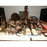 A quantity of brassware to include miniature cannon, bell, rickshaw, animals, Venetian gondala,