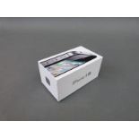 A boxed iPhone 4s,