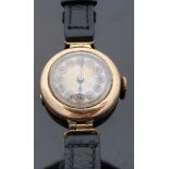 A 9ct gold ladies wristwatch with blued hands, gold face, inset black Roman numerals,