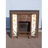 An Art Nouveau style cast iron fire surround